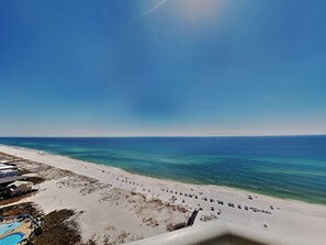 A beach with a pool and a clear view of the ocean. - Emerald Isle #1707 by Southern Vacation Rentals (Pensacola Beach)