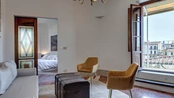 Apartment, Balcony | Living area | 50-inch flat-screen TV with digital channels