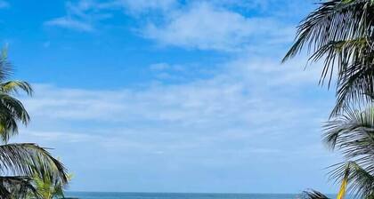 Balcony Room– Peaceful Stay Near Beach & Town