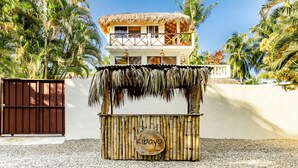 A beachside kiosk with a thatched roof and a sign reading "Kibayo". - Kibayo Lagoon Villa in Cabarete (Sosúa)