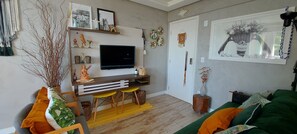 Comfort Apartment | Living area | 40-inch Smart TV with digital channels, Netflix, streaming services
