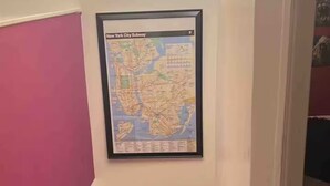 A staircase with a framed map of the New York City Subway on the wall. - 2 Pvt bed Rm 1bathroom no kitchen attic (Uniondale)