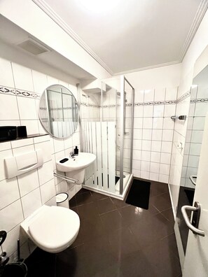 Shower, towels, toilet paper