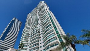 Two high-rise buildings with a clear blue sky.