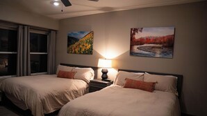 A hotel room with two beds, a nightstand with a lamp, and two wall-mounted paintings. - Edelweiss MTN Haus, Summer Base Camp Steps from PCMR, Pool, Hot Tub. Local Hosts (Park City)