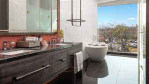 A modern bathroom with dual sinks, a large mirror, and a freestanding bathtub. - Movenpick By Accor Qingdao Sunmei (Qingdao)