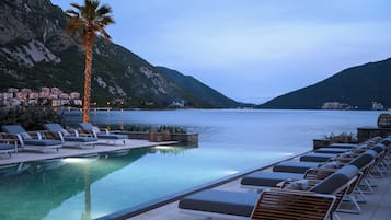 Indoor pool, outdoor pool, open 9:00 AM to 9:00 PM, pool umbrellas