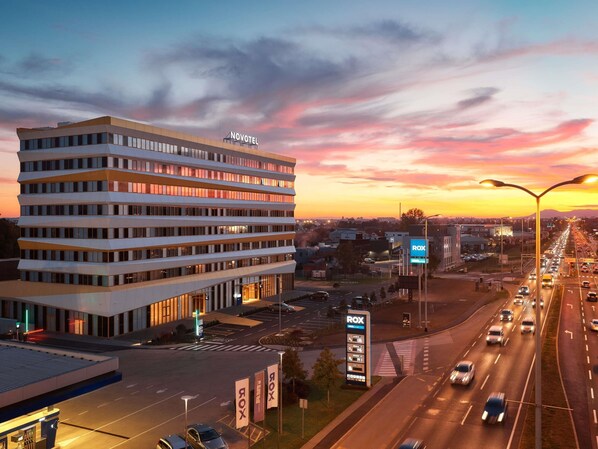 A modern hotel with a flat roof, multiple floors, and a parking lot. - Novotel Zagreb - opened September 2025 (Zagreb)