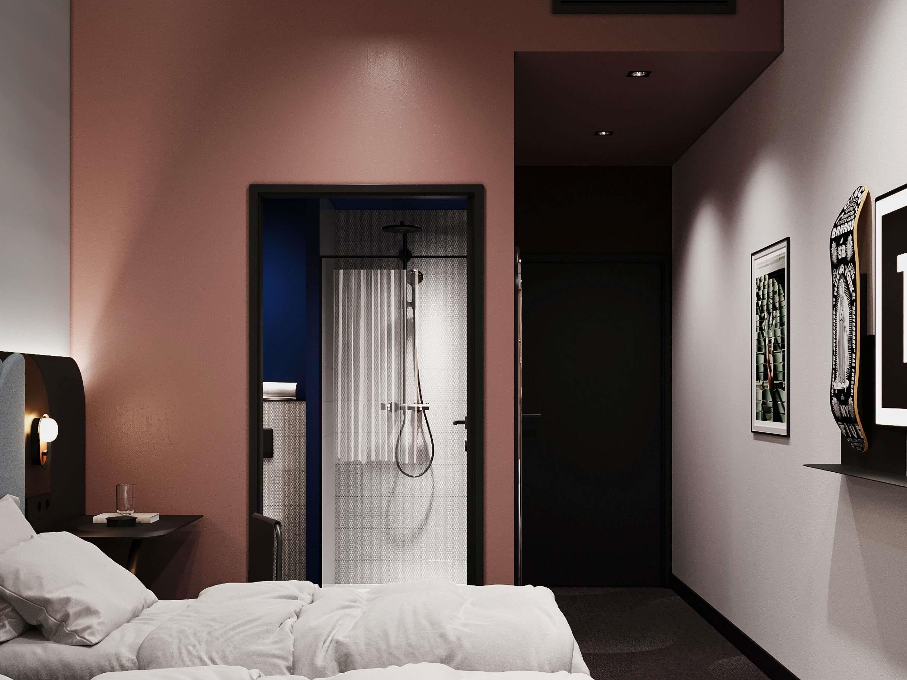 A hotel room with a bed, a nightstand, a glass of water, a shower, and a door leading to another room.
