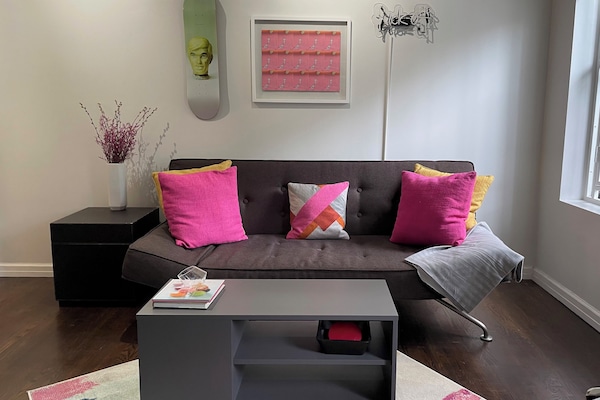 Living room with fold down couch into Full XL size bed