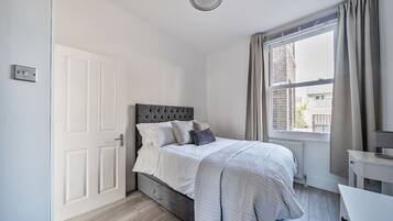1 bedroom, desk, iron/ironing board, travel crib
