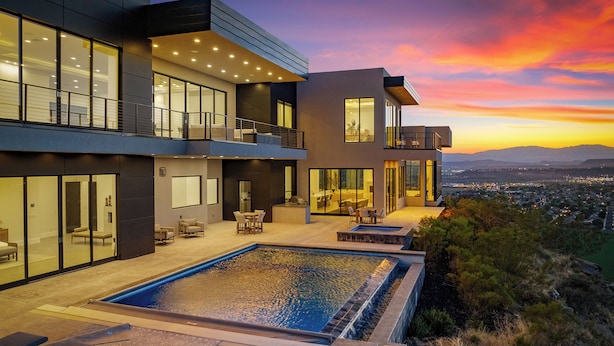 A modern multi-story house with a large outdoor swimming pool, outdoor seating, and a view of the city at sunset. - Zion Mountain / Pool, Hot Tub, BBQ & Pickleball (Washington)