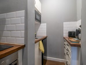 Fridge, toaster, dining tables