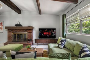 Smart TV, fireplace, books