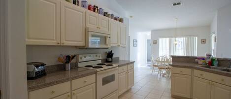 Fridge, coffee/tea maker, cookware/dishes/utensils