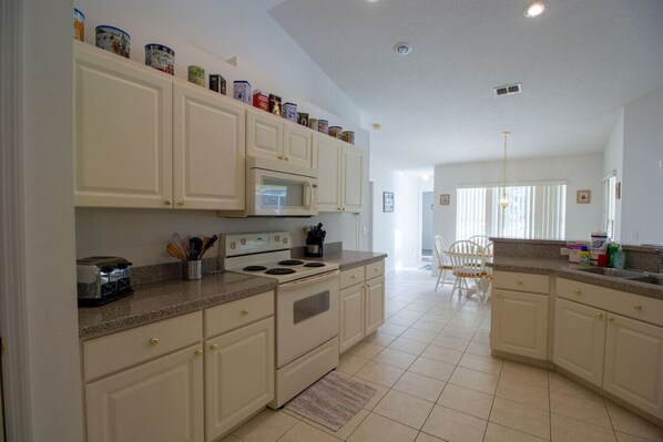 Fridge, coffee/tea maker, cookware/dishes/utensils