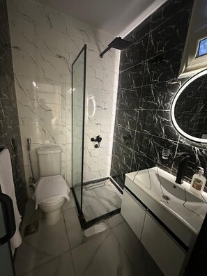 Shower, hair dryer, towels, soap - inside pyramids hotel (Giza)