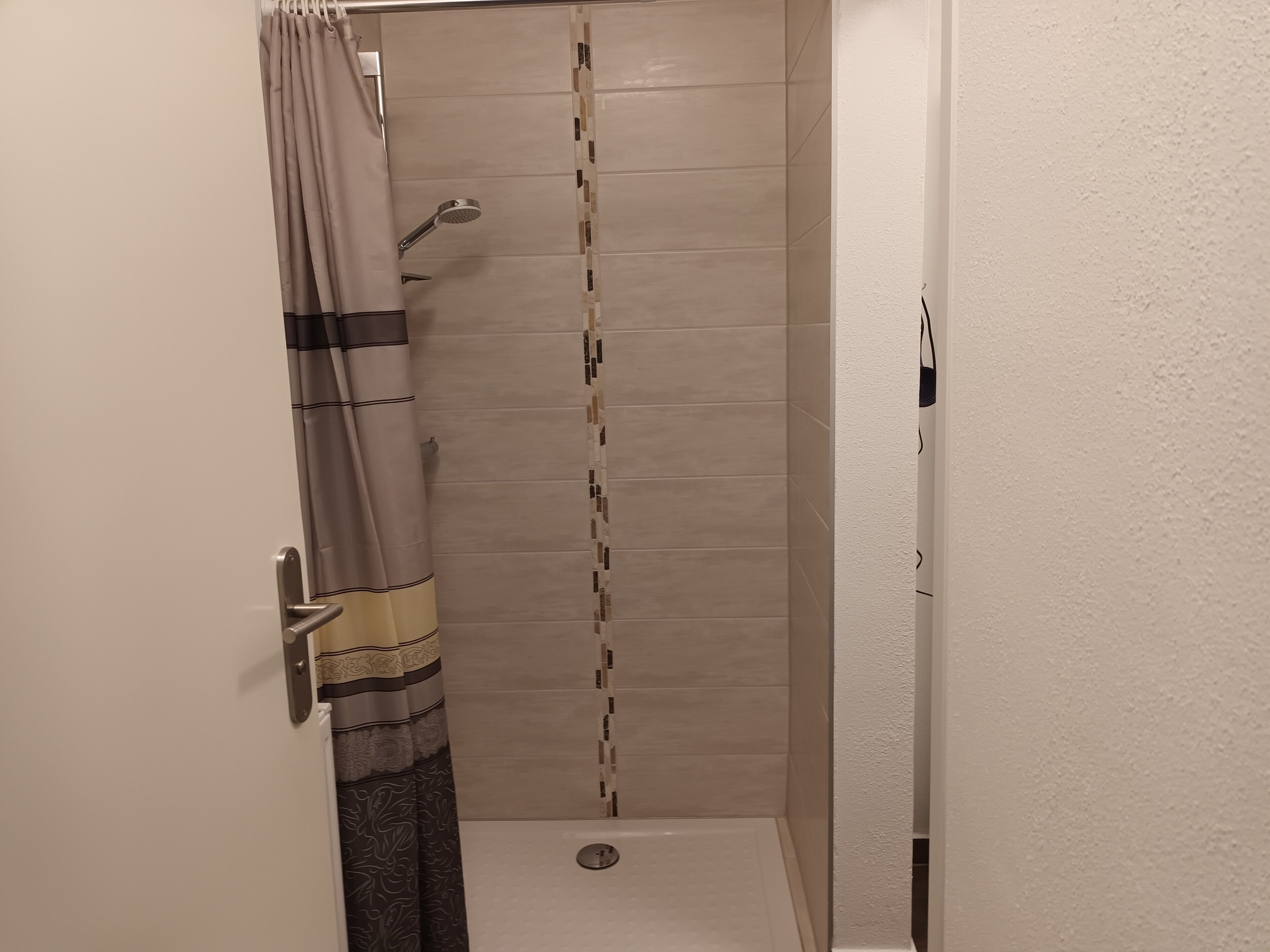 Shower, hair dryer, towels, toilet paper