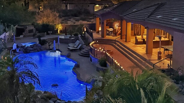 A pool area with a hot tub, lounge chairs, and a covered patio. - Pickleball Court! +GIANT Pool w/Waterslide! Game Room, Hot Tub, Golf+ (Mesa)