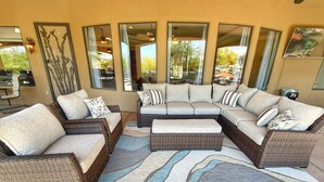 A modern living room with a sectional sofa, a coffee table, and a large rug. - Pickleball Court! +GIANT Pool w/Waterslide! Game Room, Hot Tub, Golf+ (Mesa)