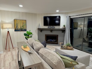 Smart TV, fireplace, books