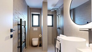 A modern bathroom with a toilet, bidet, and a large mirror above the sink. - Stay Here Living  (Thiersee)