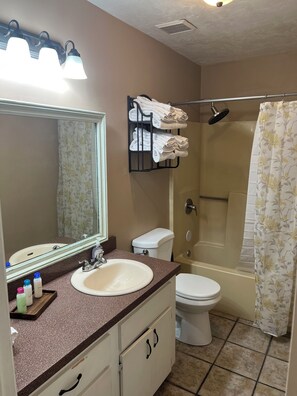 Shower, towels, soap, toilet paper