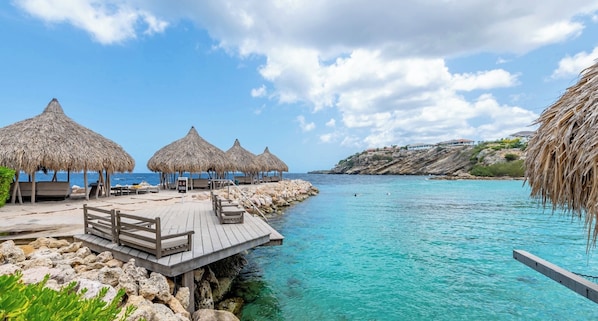 On the beach, sun loungers, beach towels