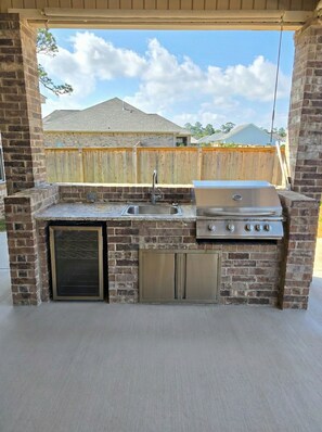 Terrace/patio - Experience the gold standard of Ocean Springs. Private 3BR home with a personal touch you won't find in hotels. Space, style, and local soul. (Ocean Springs)