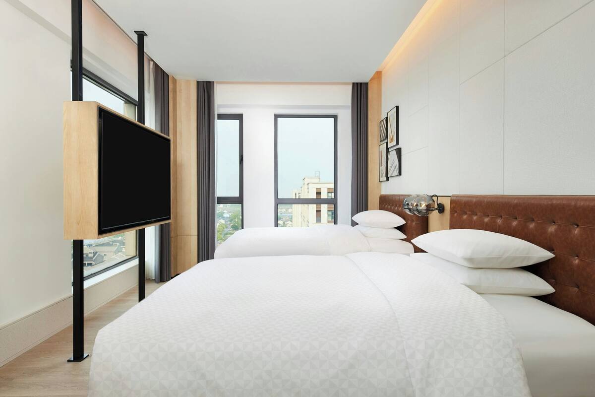 Premier Suite, 2 Queen Beds, Bathtub, City View | Down duvets, free minibar items, in-room safe, laptop workspace