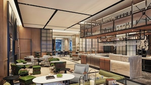 A modern hotel lobby with a bar area, seating arrangements, and a view of the cityscape. - Four Points By Sheraton Shanghai International Tourism And Resorts Zone (Shanghai)