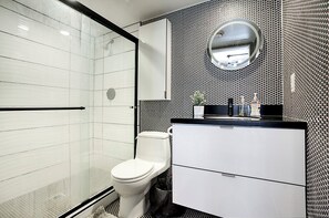 Shower, towels, soap, toilet paper
