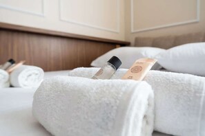 Shower, hair dryer, towels, shampoo