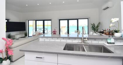 4-Bedroom, 4-Bath Oasis in Treasure Cay – WiFi, AC, Steps from the Water