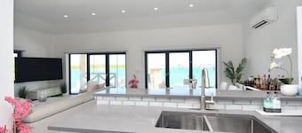 4-Bedroom, 4-Bath Oasis in Treasure Cay – WiFi, AC, Steps from the Water