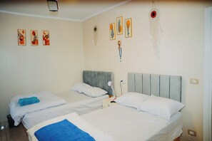 2 habitaciones, tabla de planchar con plancha, wifi y ropa de cama 