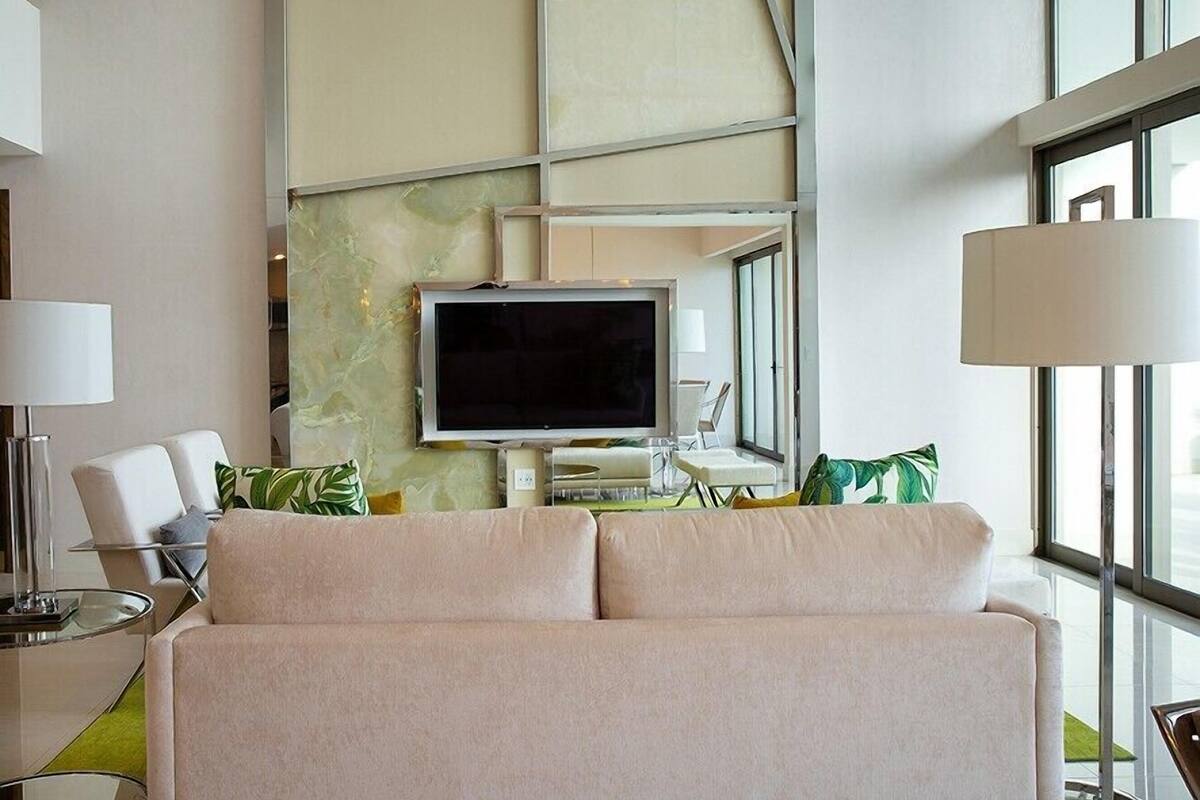 Penthouse Deluxe, vista a la playa | Área de sala de estar