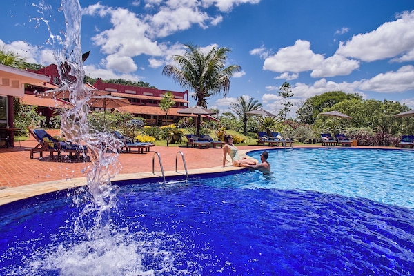 Indoor pool, outdoor pool, pool umbrellas, pool loungers