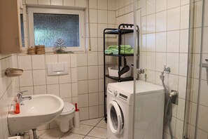 Shower, hair dryer, towels