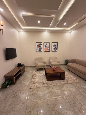 Suite Premium, vista città | Area soggiorno