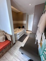 Luxury Suite, Balcony, Beach View | Bathroom | Bathrobes, slippers