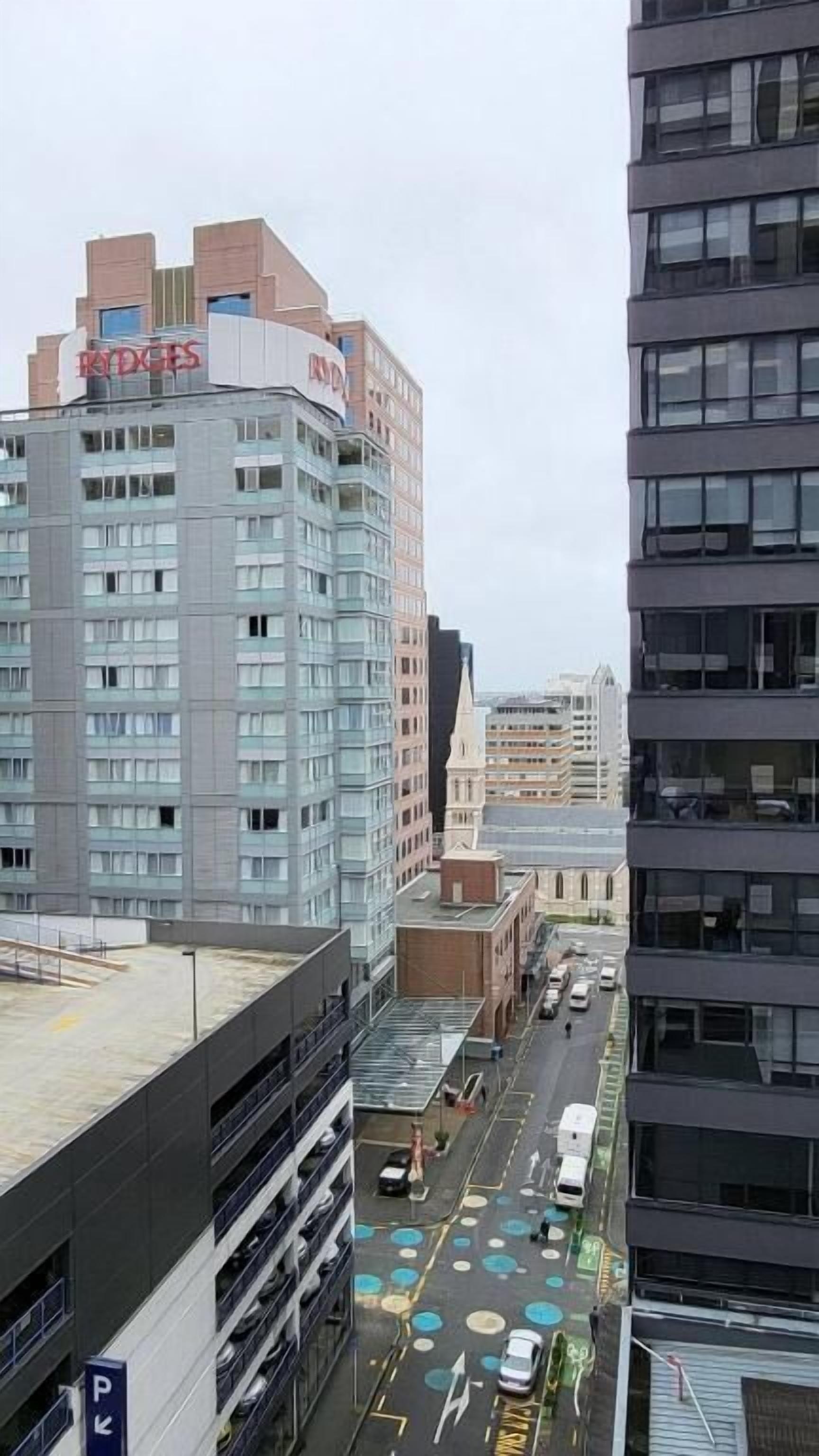 A multi-story building with a prominent sign reading "RIDGES".