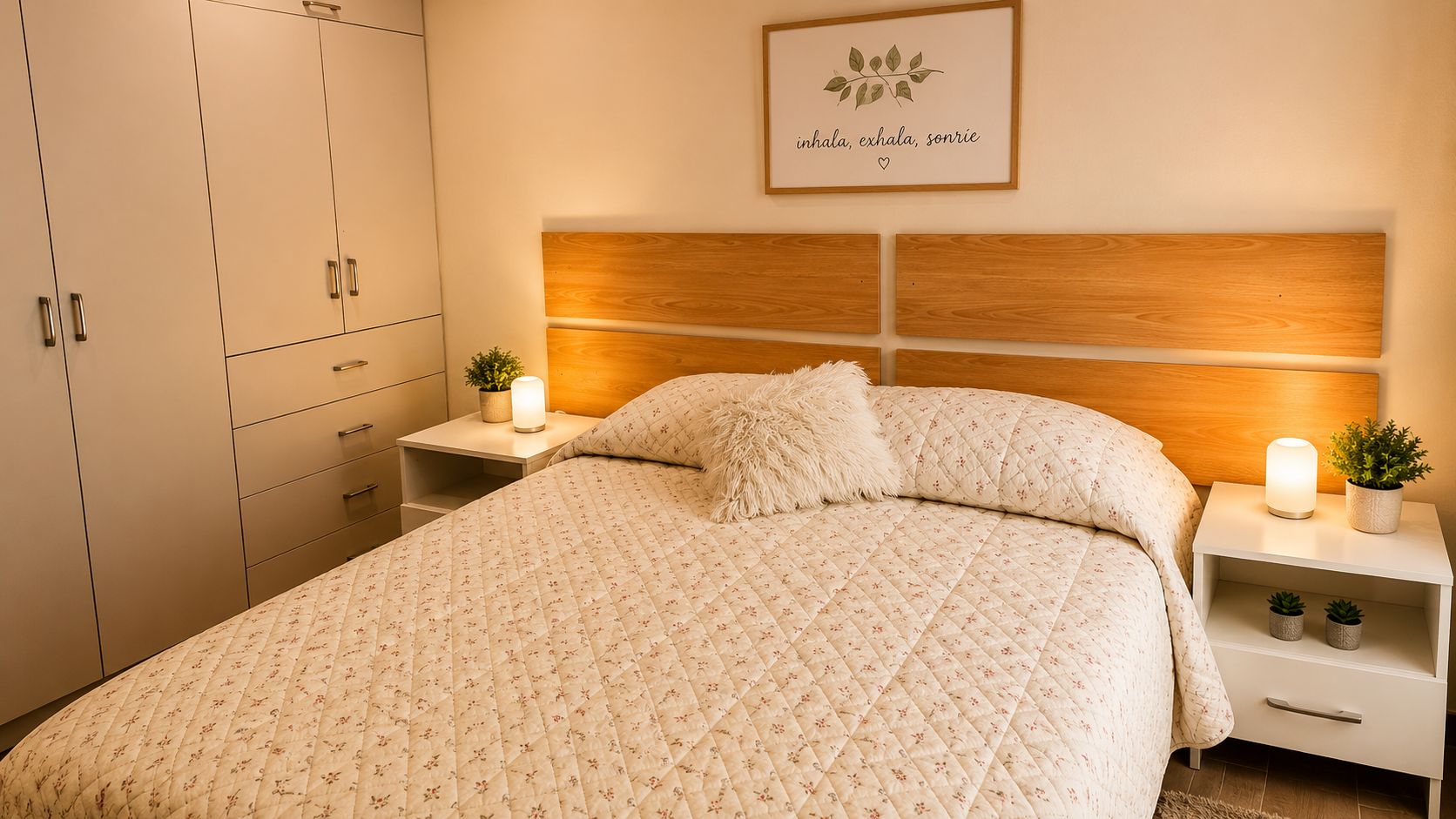 A bedroom with a bed, nightstands, a wall-mounted shelf, and a wardrobe.