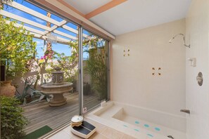 Shower, hair dryer, towels, shampoo