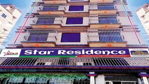 A multi-story hotel with balconies and a prominent 'Star Residence' sign. - Hotel Star Residence (Dhaka)