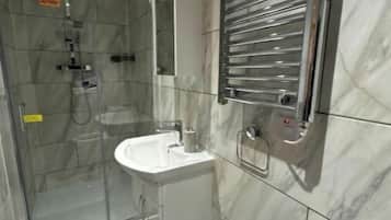 Shower, towels, soap, toilet paper