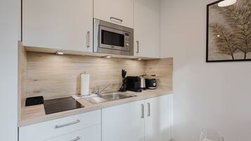 Fridge, microwave, stovetop, coffee/tea maker