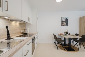 Fridge, microwave, stovetop, coffee/tea maker