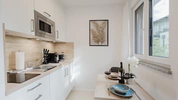 Fridge, microwave, stovetop, coffee/tea maker