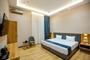 In-room safe, desk, laptop workspace, blackout drapes - Ajwa Plaza Premium Hotel (Bukhara)